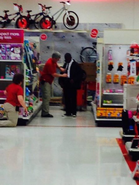 Target's excellent customer service example: Man helping teen tie his first tie.